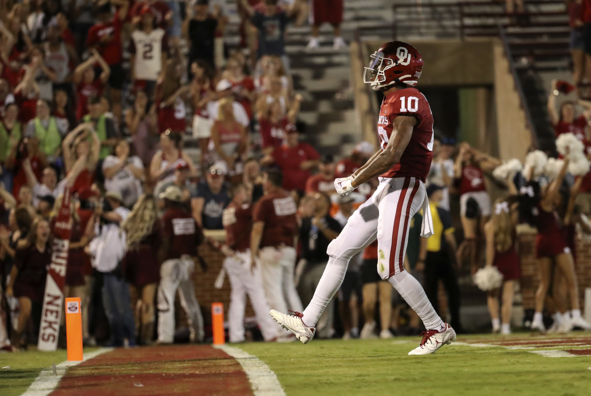 Sep 7, 2019; Norman, OK, USA; Oklahoma Sooners wide receiver Theo Wease (10) reacts after scoring a touchdown during the second half against the South Dakota Coyotes at Gaylord Family - Oklahoma Memorial Stadium. Credit: Kevin Jairaj-USA TODAY Sports